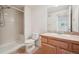 Bathroom with shower, oak vanity and tile floors at 6803 W Yale Ave, Lakewood, CO 80227