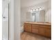Bright bathroom showcasing a double sink vanity and bathtub at 6803 W Yale Ave, Lakewood, CO 80227