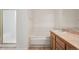 Bathroom featuring a tub, shower, and oak vanity at 6803 W Yale Ave, Lakewood, CO 80227