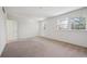 Spacious bedroom with neutral carpet, multiple windows, and ample natural light at 6803 W Yale Ave, Lakewood, CO 80227