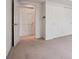 Bedroom with an open door, closet with sliding doors, and neutral carpet at 6803 W Yale Ave, Lakewood, CO 80227