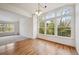 Bright living area with large windows and hardwood floors at 6803 W Yale Ave, Lakewood, CO 80227