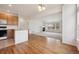 Open-concept living area with a fireplace and seamless access to the adjacent kitchen at 6803 W Yale Ave, Lakewood, CO 80227