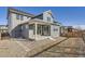 Exterior view of a well-maintained home, featuring a covered back patio at 2670 E 102Nd Pl, Thornton, CO 80229