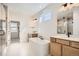 Primary bathroom featuring dual vanities, soaking tub, and glass shower at 2670 E 102Nd Pl, Thornton, CO 80229