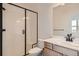 Modern bathroom featuring a glass-enclosed shower and stylish vanity at 2670 E 102Nd Pl, Thornton, CO 80229