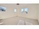 Large bedroom with bright windows and neutral carpet at 2670 E 102Nd Pl, Thornton, CO 80229