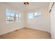 Bright bedroom with three windows and closet with sliding door at 2670 E 102Nd Pl, Thornton, CO 80229