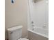 Close-up of a clean, white bathroom featuring a toilet and a tiled shower-tub combination at 19088 E 94Th Pl, Commerce City, CO 80022