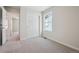 This bedroom features neutral carpeting, a window and closet with paneled doors at 19088 E 94Th Pl, Commerce City, CO 80022