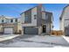 Front exterior of a modern two-story home with snow on the ground and a two car garage at 19088 E 94Th Pl, Commerce City, CO 80022