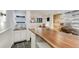 Basement bar area with rock accents, wine rack, countertop, and sink at 5396 Bear Mountain, Evergreen, CO 80439