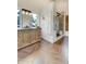 Elegant bathroom features a stylish vanity with drawers, modern fixtures, and a glass shower at 5396 Bear Mountain, Evergreen, CO 80439