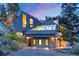 Unique home with distinctive architectural elements, including a stone facade and glass roof at 5396 Bear Mountain, Evergreen, CO 80439