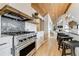 Modern kitchen featuring stainless steel appliances, a spacious island, and wood accents for a rustic touch at 5396 Bear Mountain, Evergreen, CO 80439