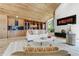 Inviting living room featuring hardwood floors, vaulted wood ceilings, and stylish decor at 5396 Bear Mountain, Evergreen, CO 80439