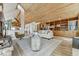 Inviting living room featuring hardwood floors, vaulted wood ceilings, and stylish decor at 5396 Bear Mountain, Evergreen, CO 80439