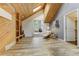 Spacious living room featuring hardwood floors, vaulted ceilings, and a cozy fireplace at 5396 Bear Mountain, Evergreen, CO 80439