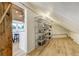 Walk-in pantry with ample shelving and storage solutions, adjacent to a modern kitchen area at 5396 Bear Mountain, Evergreen, CO 80439