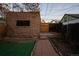 Brick outbuilding in backyard features steps and walkway of brick at 374 S Lincoln St, Denver, CO 80209