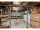 Unfinished basement with laundry appliances and exposed utilities at 374 S Lincoln St, Denver, CO 80209