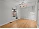 Bright bedroom with hardwood floors, ceiling fan, and ample natural light at 374 S Lincoln St, Denver, CO 80209