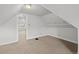 Bedroom with carpet, slanted ceiling and closet at 374 S Lincoln St, Denver, CO 80209