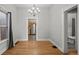 Elegant dining room leading to the kitchen with hardwood floors and natural light at 374 S Lincoln St, Denver, CO 80209