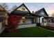 Charming bungalow with a cozy front porch and a well-manicured lawn at 374 S Lincoln St, Denver, CO 80209