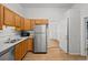 Cozy kitchen with stainless steel refrigerator, wooden cabinets and modern microwave at 374 S Lincoln St, Denver, CO 80209