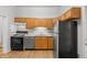 Well-lit kitchen featuring modern appliances and sleek stainless steel refrigerator at 374 S Lincoln St, Denver, CO 80209