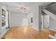 Bright living room featuring hardwood floors, a ceiling fan, and natural light at 374 S Lincoln St, Denver, CO 80209