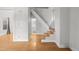 Bright living room with hardwood floors and a staircase leading to the second floor at 374 S Lincoln St, Denver, CO 80209