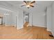 Spacious living room with hardwood floors, ceiling fan, and ample natural light at 374 S Lincoln St, Denver, CO 80209