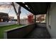 View from a charming front porch with a covered area and well manicured lawn at 374 S Lincoln St, Denver, CO 80209