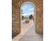 Stunning view through a stone archway, showcasing the community and landscape beyond at 2429 S Orchard St, Lakewood, CO 80228