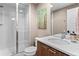 Modern bathroom featuring a glass-enclosed shower and contemporary vanity at 2429 S Orchard St, Lakewood, CO 80228
