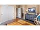 Bedroom with a large closet, modern dresser, and an open doorway to the bathroom at 2429 S Orchard St, Lakewood, CO 80228