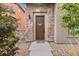 Charming front door entrance with stone surround and decorative wreath at 2429 S Orchard St, Lakewood, CO 80228