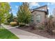 Landscaped front yard features a beautiful walkway to the home's entrance at 2429 S Orchard St, Lakewood, CO 80228