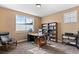 Home office with natural light and a large bookcase at 2429 S Orchard St, Lakewood, CO 80228