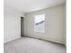 Well lit bedroom with neutral carpet and a view at 14400 Heritage Dr, Mead, CO 80504