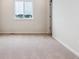 Spacious bedroom with neutral carpet, window, and ample natural light at 14400 Heritage Dr, Mead, CO 80504