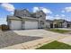 Attractive home with a spacious driveway and two-car garage, surrounded by well-maintained landscaping at 14400 Heritage Dr, Mead, CO 80504
