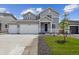 Beautiful two-story home with a two-car garage, complemented by a green lawn and modern design at 14400 Heritage Dr, Mead, CO 80504