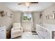 Bright Bedroom with a neutral color palette, soft decor, and a light and airy feel at 7371 Otis Ct, Arvada, CO 80003