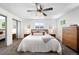 Spacious bedroom with natural light and closet, designed for relaxation and comfort at 7371 Otis Ct, Arvada, CO 80003