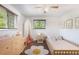 Well-lit bedroom featuring a single bed, dresser, and charming decor at 7371 Otis Ct, Arvada, CO 80003