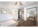 Charming bedroom showcasing a mirrored closet, cozy bed, and soft decor at 7371 Otis Ct, Arvada, CO 80003