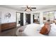 Bright bedroom with closet, connecting bathroom, and modern decor, creating a private retreat at 7371 Otis Ct, Arvada, CO 80003
